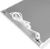 A close-up, angled view of a silver heating panel with a white power cord attached. Anteprima dell’immagine prodotto