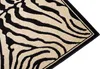 A close-up view of a rug with a zebra pattern. Produktbild-Vorschau