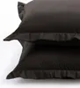 Two dark brown pillowcases are stacked on top of each other against a white background. Produktbild-Vorschau