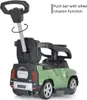 Rear view of a green Land Rover Defender 90 ride-on toy car for children, with a push bar for parental control. Náhled obrázku produktu