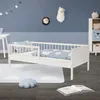 A child's bedroom with a white wooden bed, decorated with sheep-themed bedding and a cloud-shaped rug. Produktbild-Vorschau