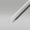 Two shoelaces, one white and one black, are laid diagonally on a light gray background. Náhled obrázku produktu