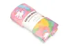 A rolled-up blanket with a unicorn print on a white background. Anteprima dell’immagine prodotto