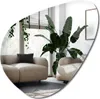 A modern living room with two beige sofas and a large potted plant. Produktbild-Vorschau