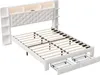 A white upholstered bed frame with a tufted headboard, integrated shelving, LED lighting, and two pull-out drawers. Produktbild-Vorschau