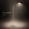 A modern LED floor lamp with a curved neck, emitting a warm light. Náhľad obrázku produktu