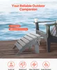 An outdoor ottoman and chair on a wooden deck next to water. Podgląd zdjęcia produktu