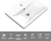 A white ceramic sink with two holes, shown from a diagonal top-down perspective. Below the sink are several icons and German text describing product features. Produktbild-Vorschau