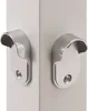 Close-up of two silver metal brackets attached to a white surface. Produktbild-Vorschau