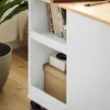 A close-up view of a white cabinet with wooden top, showing shelves with books and boxes. Náhľad obrázku produktu