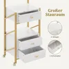 A close-up view of a white and gold rolling trolley with marble-patterned surfaces, showing open drawers and inset images highlighting storage features. Produktbild-Vorschau