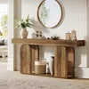 A wooden console table with decorative items and a mirror above it, placed in a well-lit hallway. Podgląd zdjęcia produktu