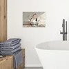 A bathroom scene with a piece of wall art featuring penguins in a bathtub. Produktbild-Vorschau
