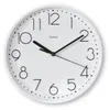 A white analog wall clock with black numbers and hands. Anteprima dell’immagine prodotto