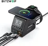 A BlitzWolf wireless charging station with a digital clock display, charging a smartphone and a smartwatch. Multiple USB cables are plugged into the front. Produktbild-Vorschau