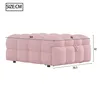 A pink upholstered ottoman with dimensions indicated by lines and numbers. Podgląd zdjęcia produktu