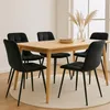 A dining table with four black chairs set up in a room. Náhľad obrázku produktu
