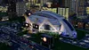 A futuristic stadium in a city at night, with cars on the road and a large billboard. Produktbild-Vorschau