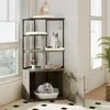 A cat tree with an integrated litter box enclosure is shown in a room with natural light coming from windows. Podgląd zdjęcia produktu