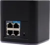 The back of a black UbiQuiti Networks airCube router is shown against a white background. The router has several Ethernet ports and a power button. Produktbild-Vorschau