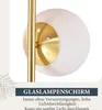 Close-up of a lamp's glass shade and gold-colored metal stem, with text overlay describing the product. Podgląd zdjęcia produktu