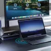 A desk setup with a monitor, laptop, and a wireless charging pad. Produktbild-Vorschau