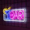 A neon sign for a bar, with a cocktail glass and the word 'BAR' illuminated. Voir les images du produit
