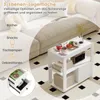A white side table with items on it, placed next to a sofa on a patterned rug. Produktbild-Vorschau