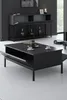 A modern living room with a black coffee table and a black console table against a black slatted wall. Produktbild-Vorschau