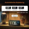A digital alarm clock displayed on a wooden surface with decorative elements. Produktbild-Vorschau