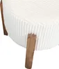A close-up view of a round, cushioned stool with wooden legs. Voir les images du produit