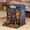 A miniature model of a bookshop with interior lighting. Náhled obrázku produktu