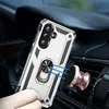 A hand holding a silver and black phone case with a ring stand, magnetically attached to a car vent mount. Produktbild-Vorschau