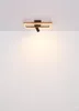 A modern rectangular ceiling light fixture with a single adjustable spotlight, mounted on a white ceiling. Podgląd zdjęcia produktu