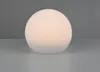 A glowing white sphere sits on a reflective surface against a gray background. Produktbild-Vorschau