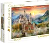 A puzzle box featuring a picturesque castle in a mountainous landscape at sunset. Podgląd zdjęcia produktu