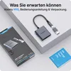 A product box and adapter are displayed on a light gray surface, with a small booklet. Produktbild-Vorschau