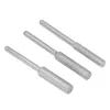 Three metal grinding bits with textured heads and smooth shafts are arranged diagonally on a white background. Produktbild-Vorschau