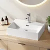 A white ceramic vessel sink with a chrome faucet is shown on a light wood vanity. Anteprima dell’immagine prodotto