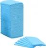 A stack of blue disposable dog pee pads and a few pads fanned out. Náhled obrázku produktu