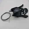A black bicycle gear shifter with a cable is placed on a white background. Anteprima dell’immagine prodotto