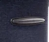 A close-up view of a handle on a dark blue fabric suitcase. Náhled obrázku produktu