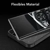 A close-up shot of a smartphone case with a phone partially inserted, showcasing its texture and design. The background is dark and textured. Produktbild-Vorschau