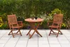 A wooden bistro set on a tiled patio with a garden in the background. Náhled obrázku produktu