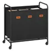 A black three-compartment laundry sorter with wheels. Produktbild-Vorschau