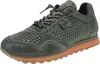 A single green sneaker with an orange sole is shown against a white background. Voir les images du produit