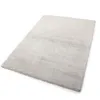 A beige rug is shown from a diagonal angle on a white background.