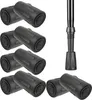 A collection of black rubber tips for trekking poles, along with a section of a trekking pole with a tip attached. Náhled obrázku produktu