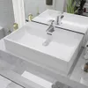 A modern bathroom sink with a chrome faucet, set against a tiled wall and marble countertop. Produktbild-Vorschau