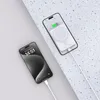 Two smartphones are shown, one charging wirelessly with a power bank, and another connected via a cable. Náhľad obrázku produktu